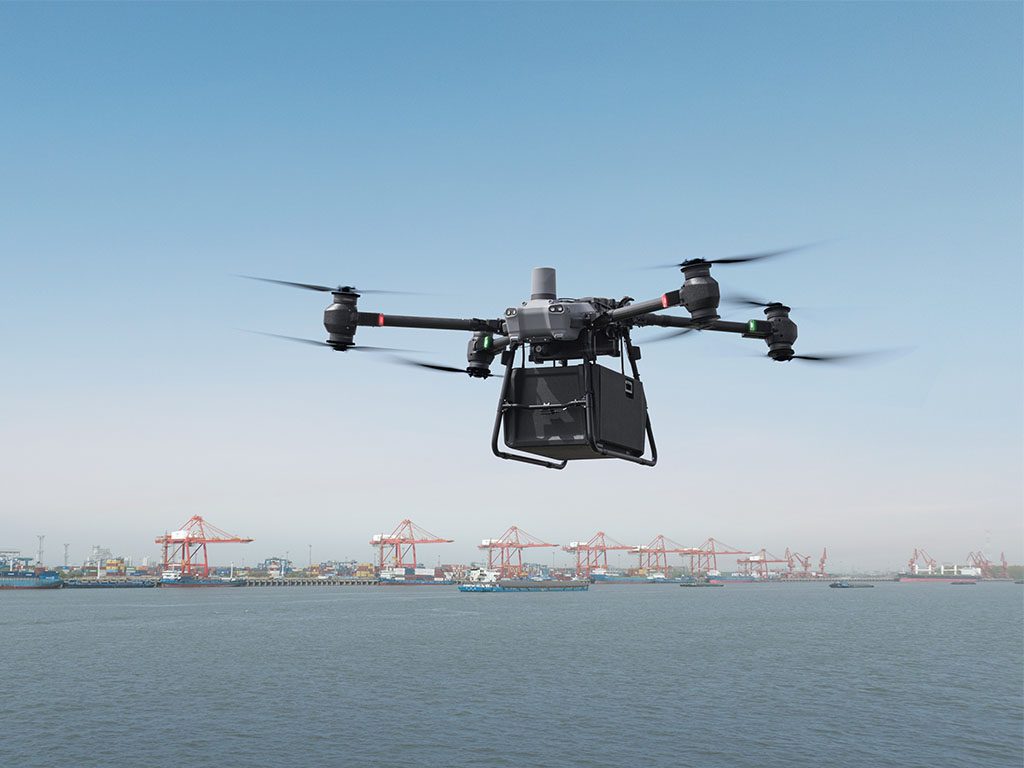 Drone-DJI-Flycart-30-in-cargo-mode-flying-into-a-port